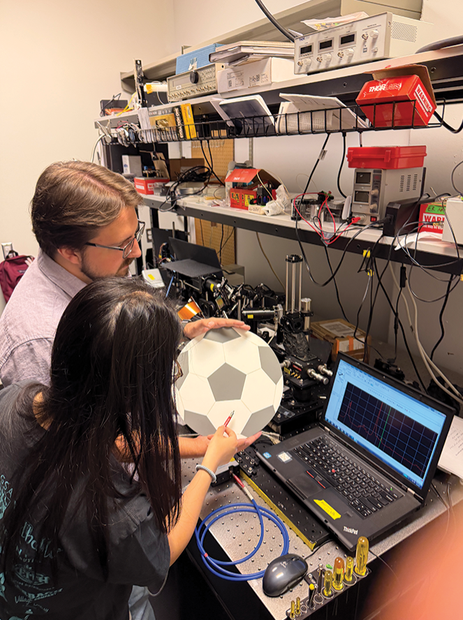 Student and faculty in lab